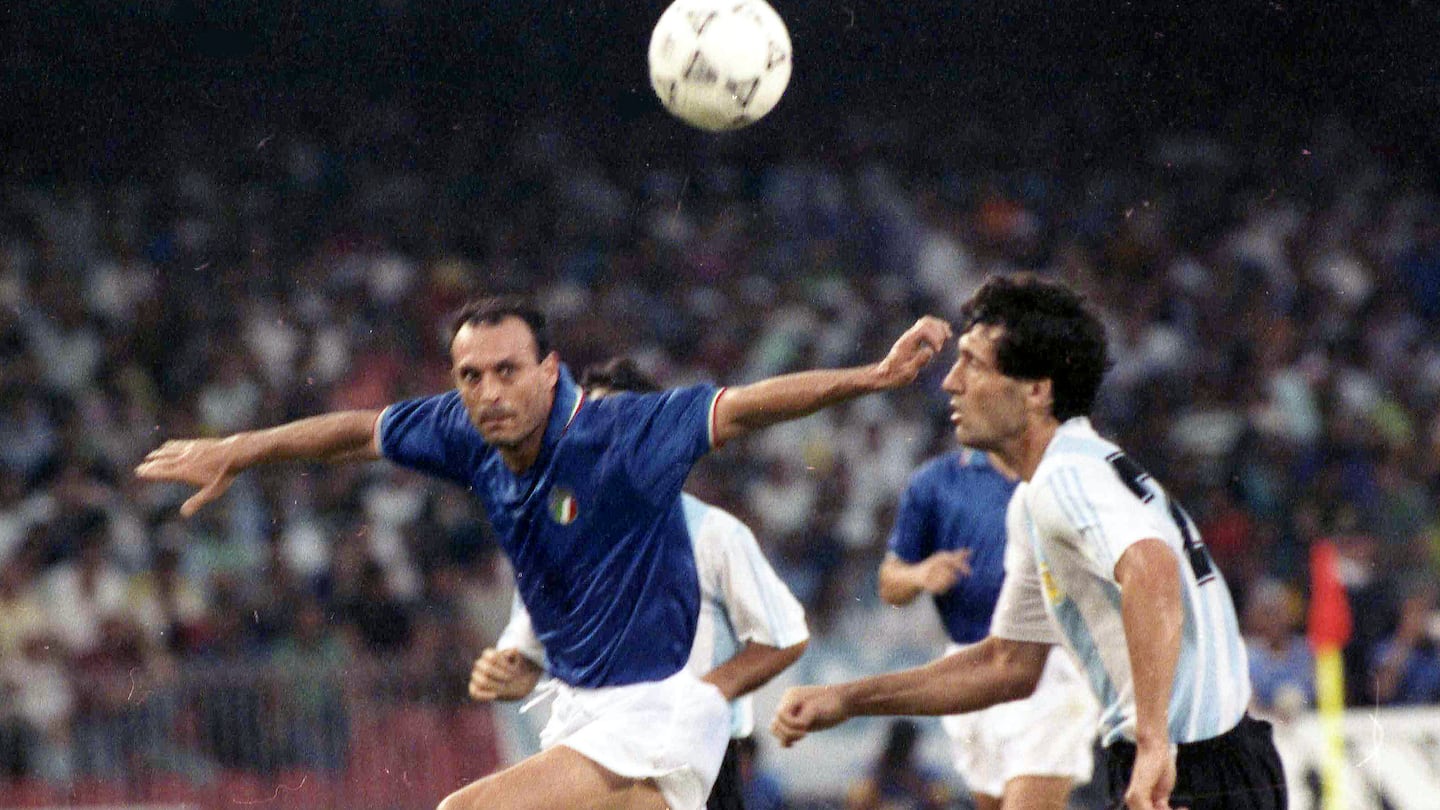 Italy's Salvatore "Totò" Schillaci, left, and Argentina's Juan Simon during the Soccer World Cup semi-final, in Naples, Italy, July 3, 1990.