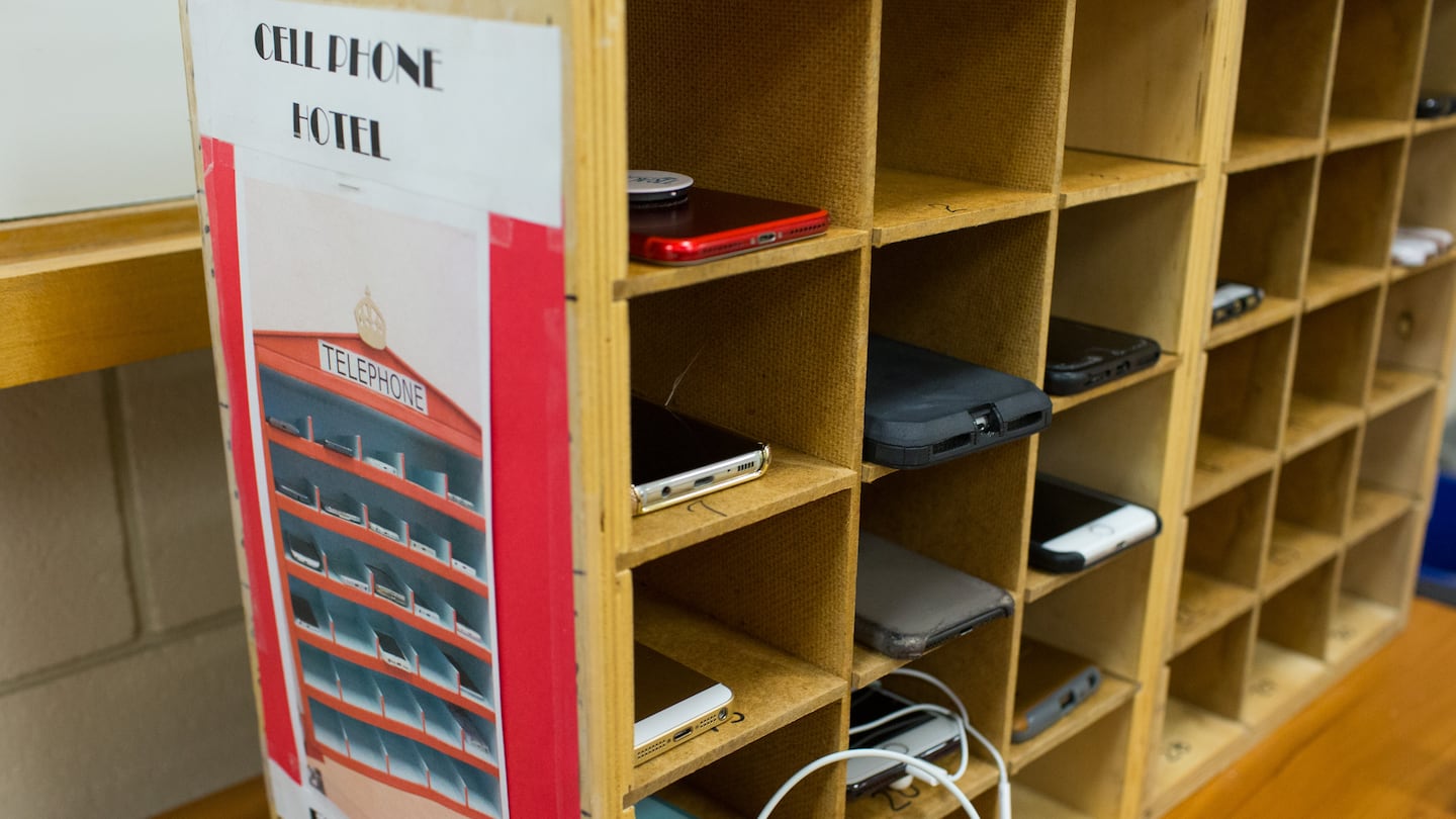 Cell phones fill the phone hotel in Gerry Padilla's Spanish class at Marlborough High School in Marlborough, Massachusetts on May 1, 2018. Students place their phones in one of the numbered cubby holes at the start of class and can retrieve them at the end of class. Cell phone use is not allowed in the classroom.