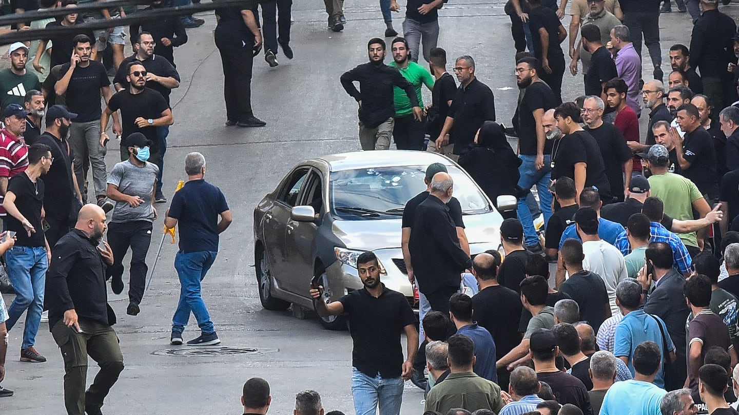 People reacted after a reported explosion occurred during the funeral of those killed when hundreds of paging devices exploded across Lebanon the previous day, in Beirut's southern suburbs on Wednesday.