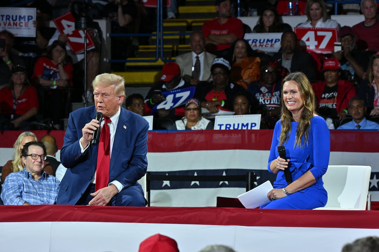 Former president Donald Trump participates in a town hall event moderated by Arkansas Governor Sarah Huckabee Sanders in Flint, Mich., on Tuesday.