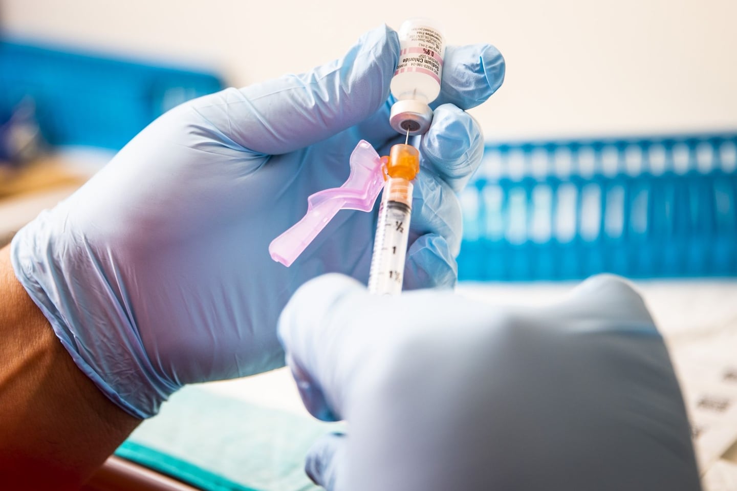 A health care worker prepares a dose of the Pfizer-BioNTech COVID-19 vaccine at Boston Medical Center on June 17, 2021.