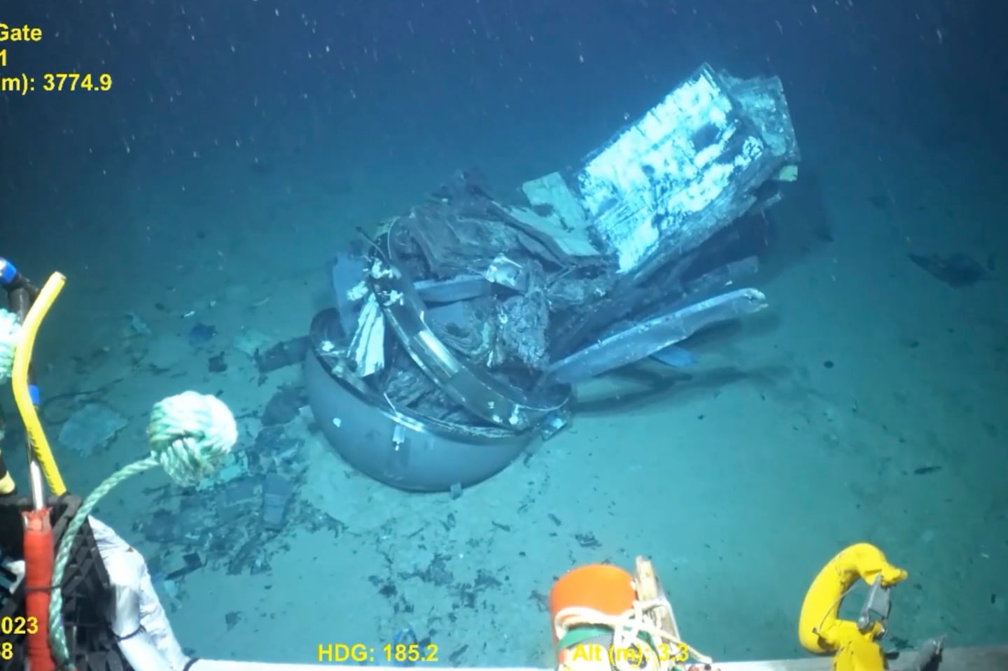 This June 2023 United States Coast Guard still frame from video provided by Pelagic Research Services, shows remains of the Titan submersible, center, on the floor of the Atlantic Ocean.