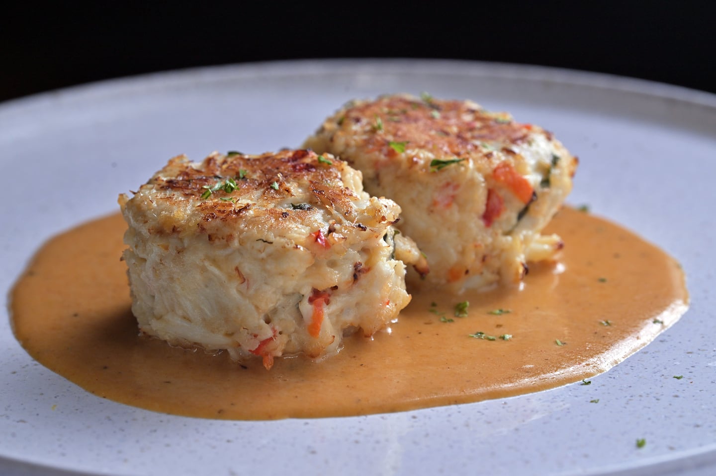 Crab cakes with colossal crab and lobster sauce at Post 1917.