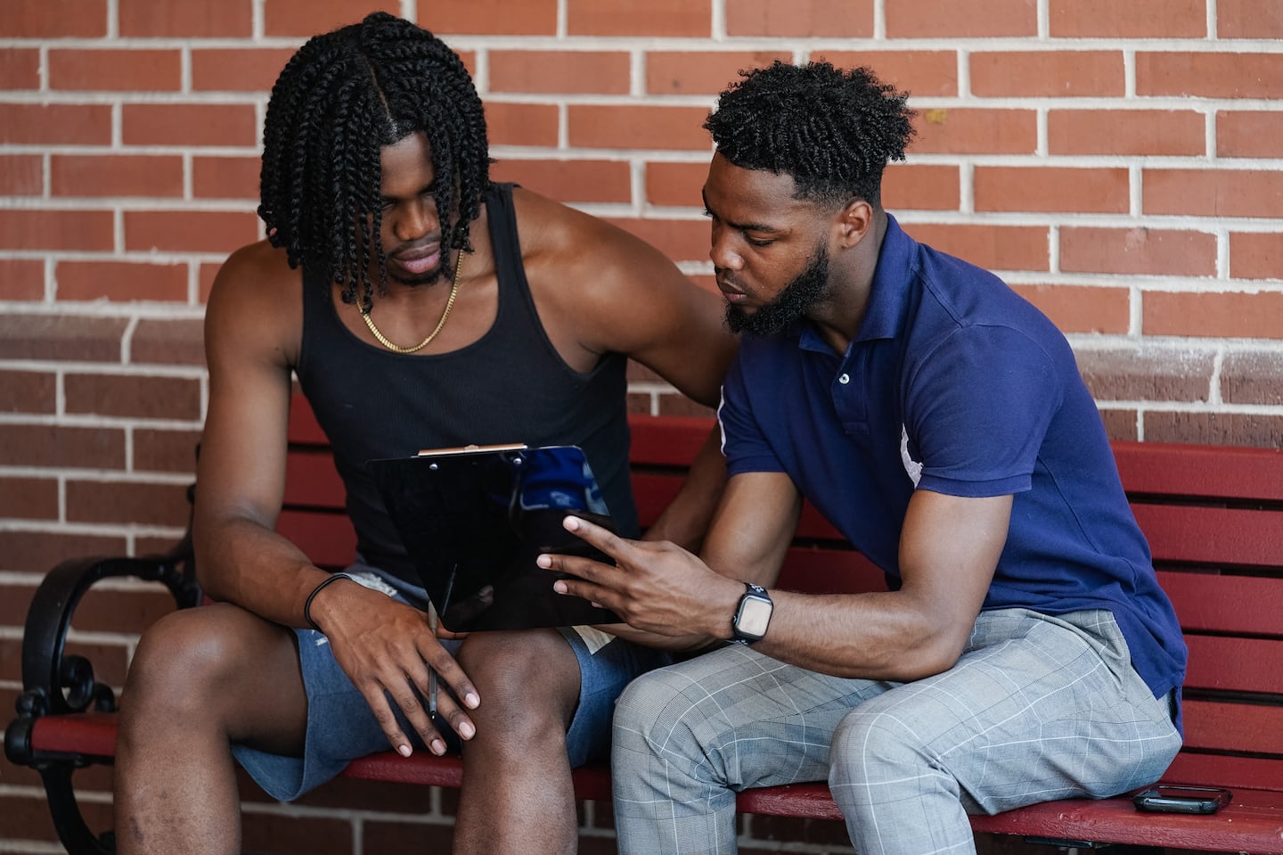 Marchellos Scott, right, helped fellow student Justin Sims fill out a voter registration form at Morehouse College on Aug. 19 in Atlanta.