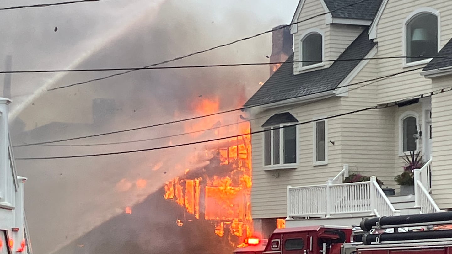 The fire at 50 Oceanside Drive was fueled by wind Friday afternoon.