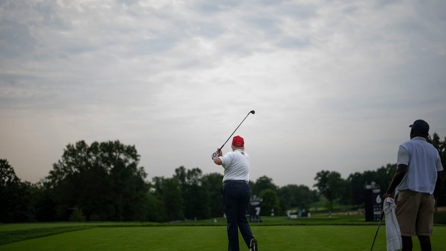 Former president Donald Trump hitp his shot from the fairway during the Pro-Am round of the LIV Golf Bedminster 2023 at the Trump National Golf Club Bedminster in Bedminster, N.J., on Aug. 10, 2023.