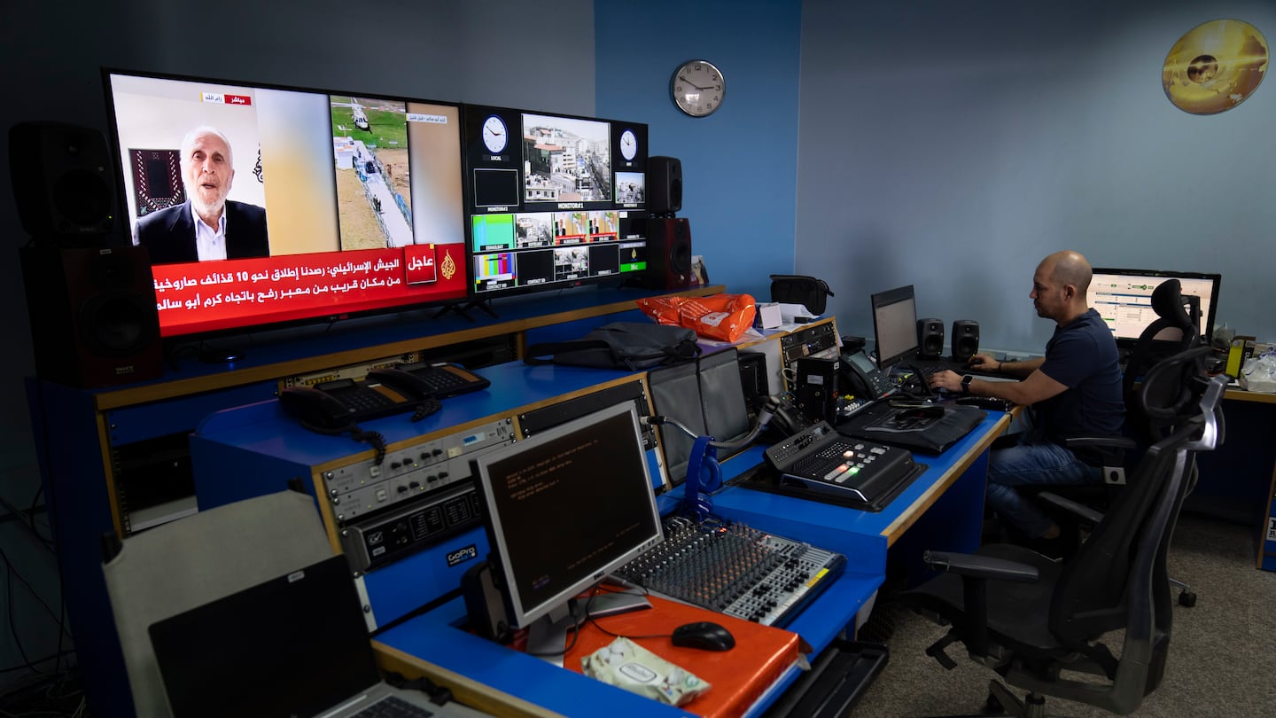 Al Jazeera broadcast engineer Mohammad Salameh works at the Master Control Room unit inside the network's office in the West Bank city of Ramallah, on May 5.