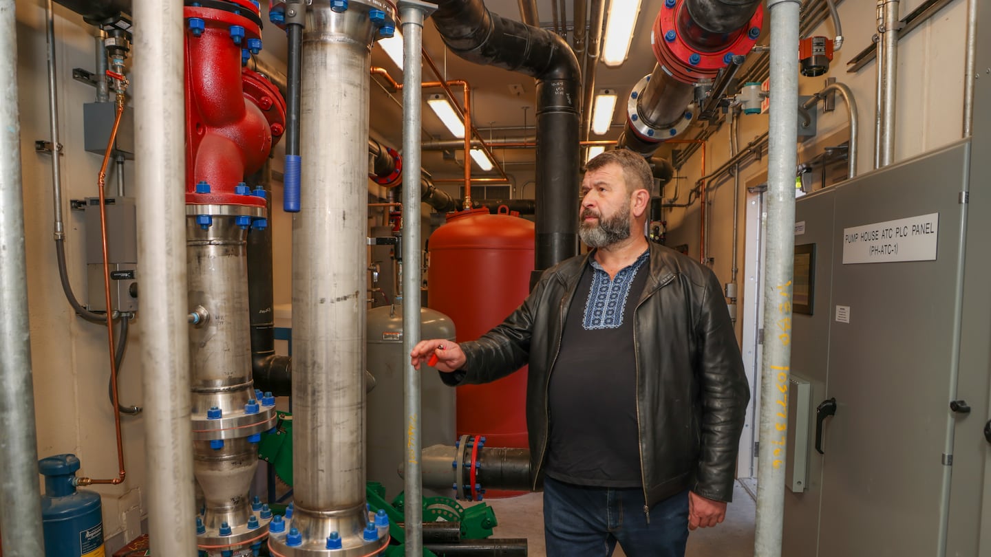 Andrii Vedmid, deputy head of the Ministry for Communities, Territories and Infrastructures Development for Ukraine, examined the geothermal energy plant at an Eversource facility adjacent to Framingham Public Schools administrative offices.