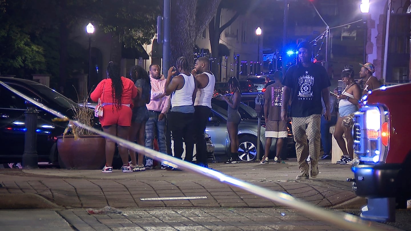 Bystanders near the scene of a shooting in Birmingham, Ala., on Sept. 22.