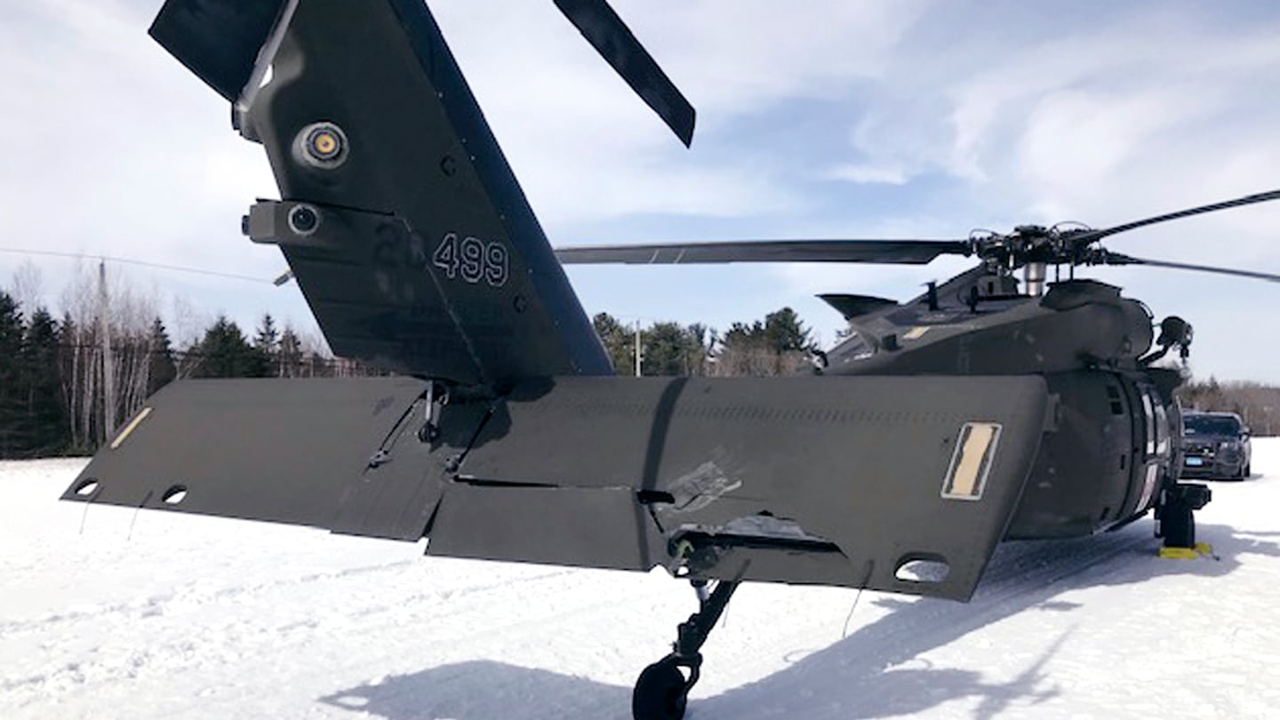 This U.S. Army photograph shows the damaged Black Hawk helicopter resting in the snow in 2019, in Massachusetts.