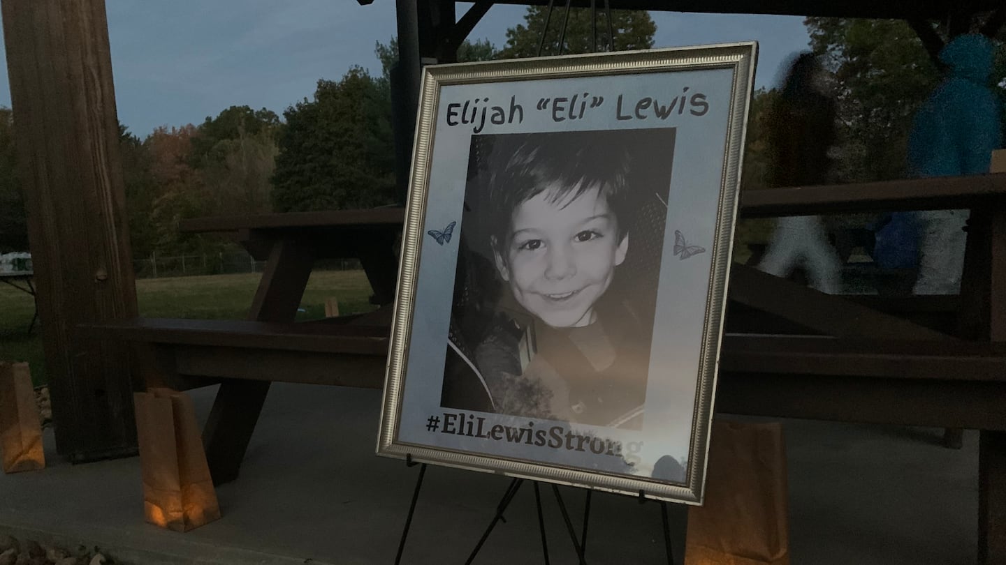 A photo of Elijah Lewis on display during a 2021 vigil in Merrimack, N.H.