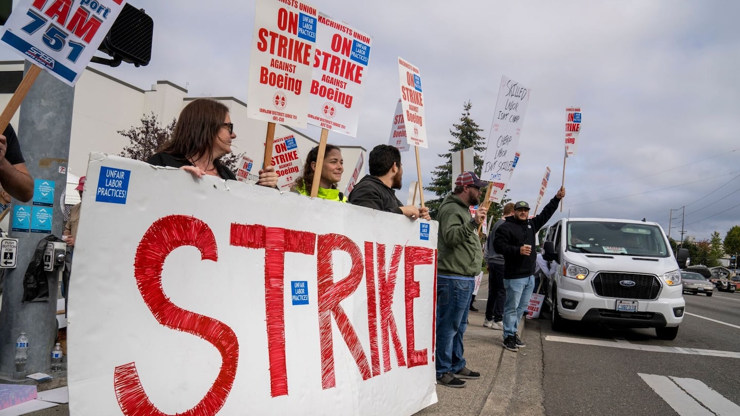 Workers with picket signs outside the Boeing Co. manufacturing facility in Everett, Wash., earlier this month.