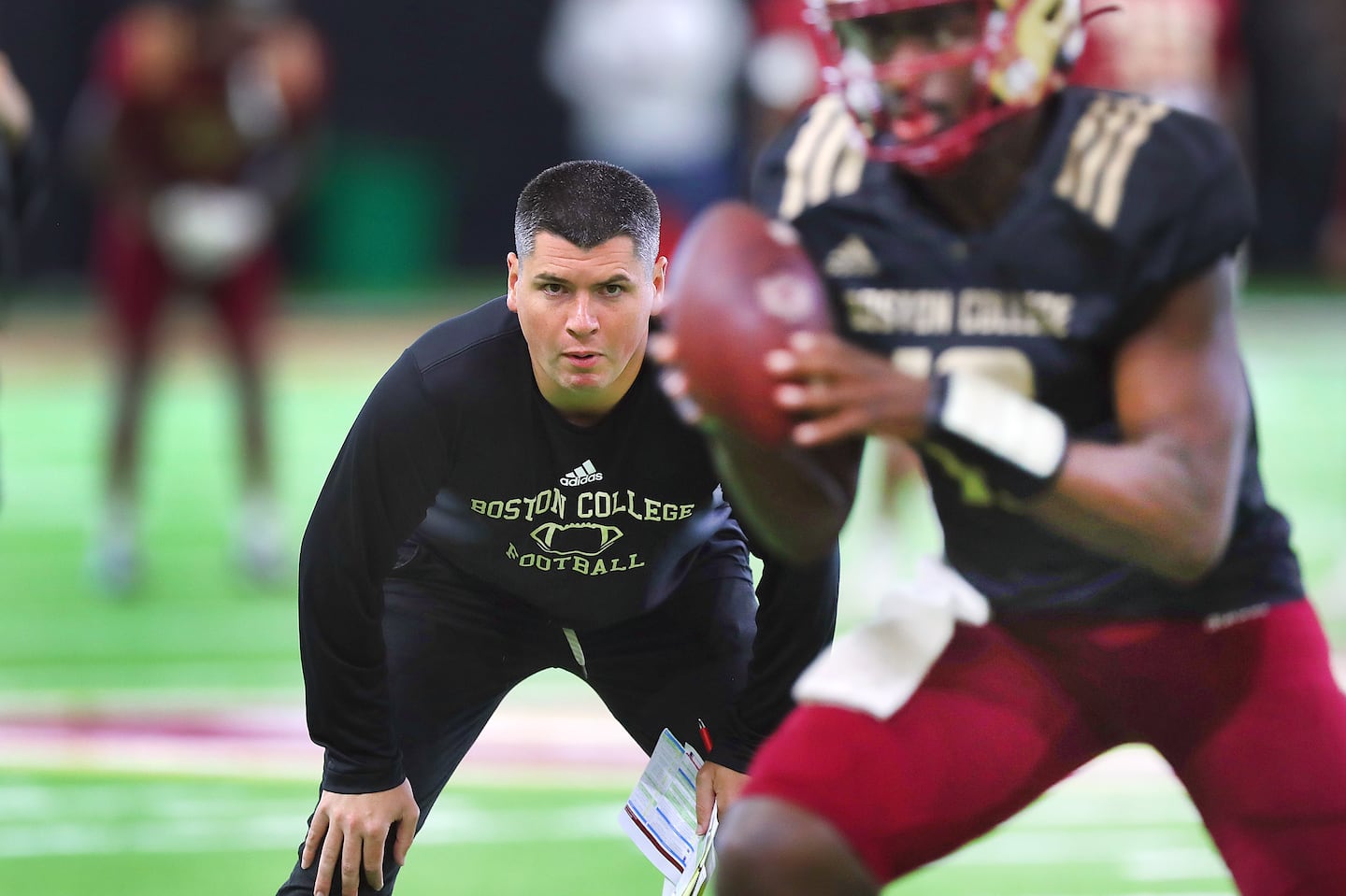 Assistant coach Jonathan DiBiaso keeps a close eye on the quarterbacks for the 3-1 Eagles.