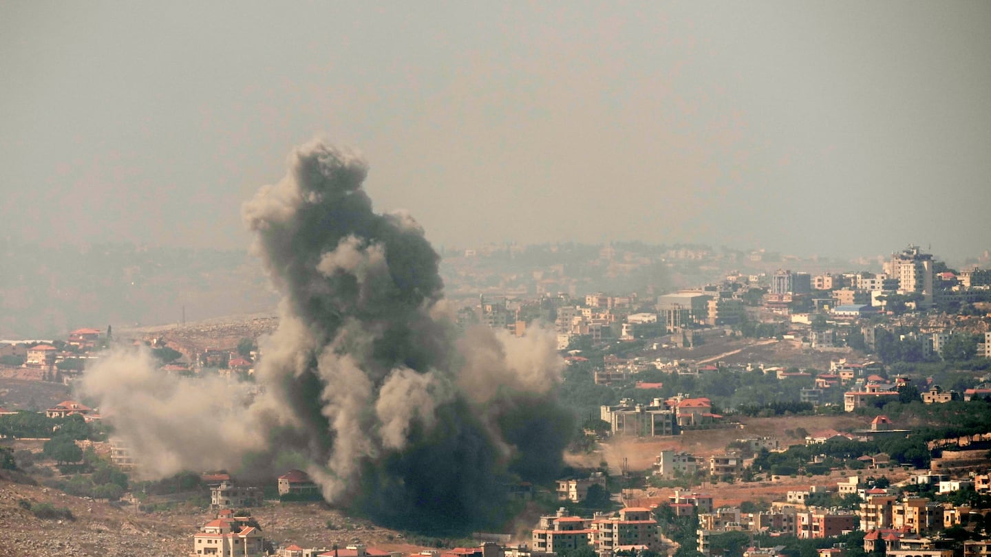 Smoke rises from Israeli airstrikes in the southern village of Kfar Rouman, seen from Marjayoun, south Lebanon, on Sept. 25.