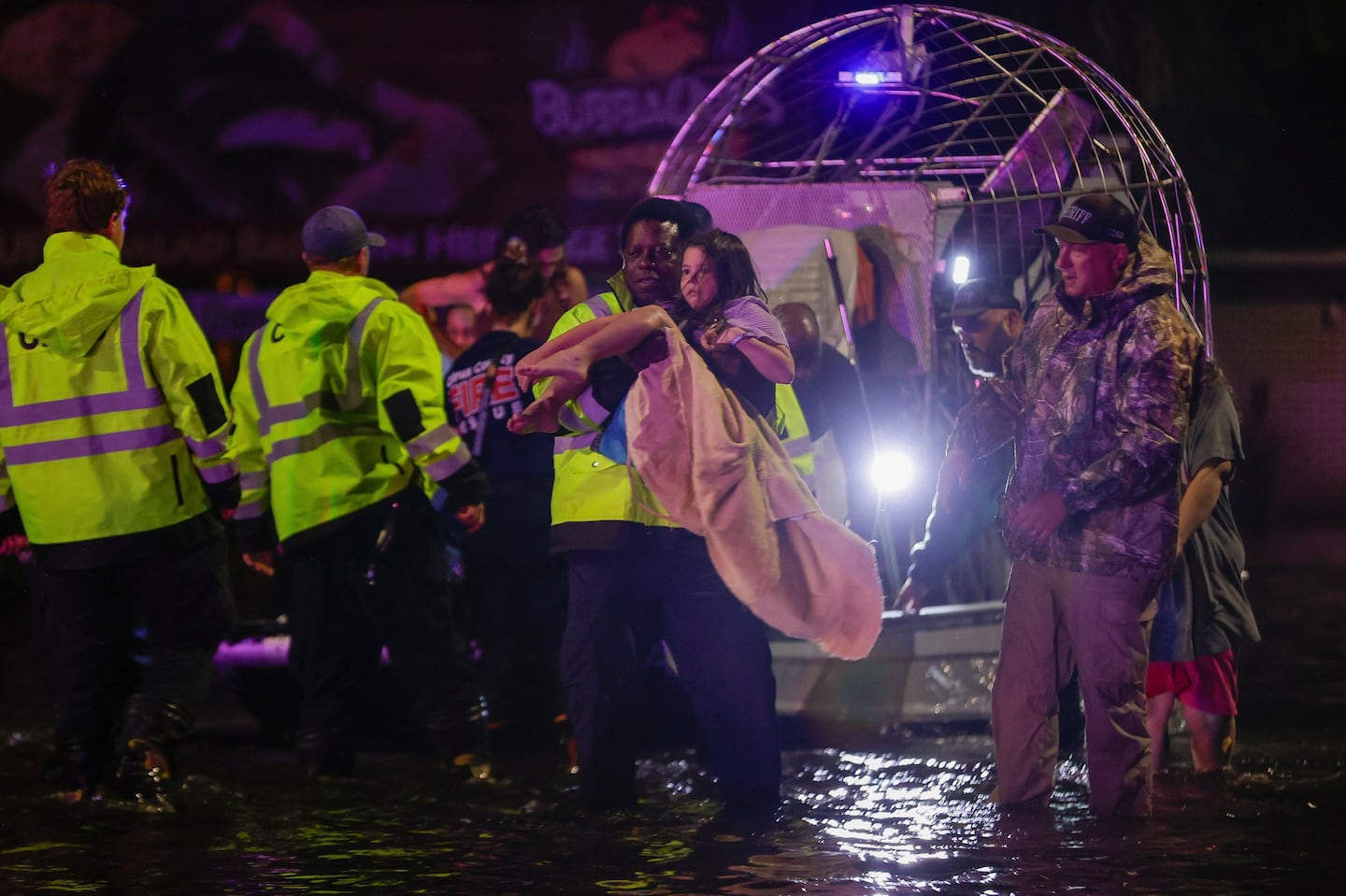 An airboat transports residents rescued from floodwaters in the aftermath of Hurricane Helene on Friday in Crystal River, Fla.