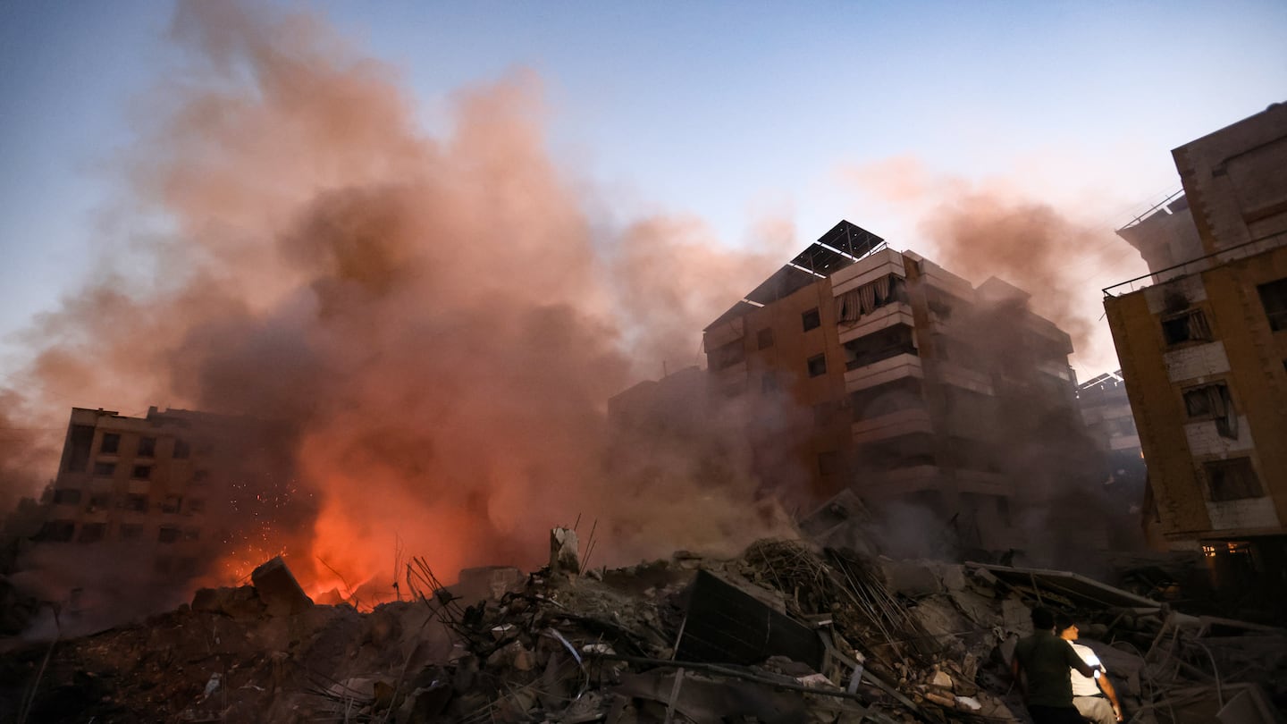 Smoke rises from the smouldering rubble at the scene of Israeli air strikes in the Haret Hreik neighbourhood of Beirut's southern suburbs on Friday.