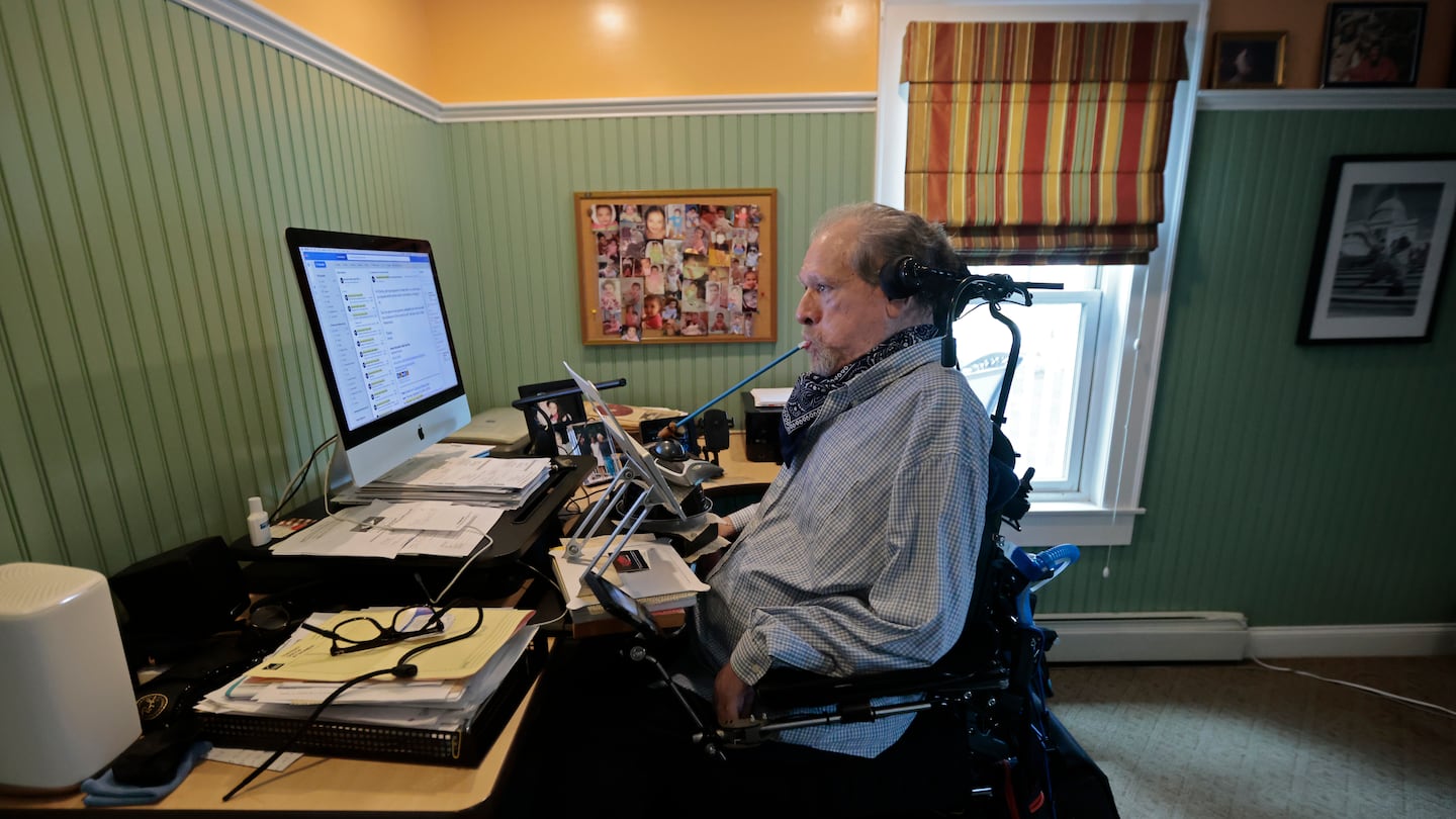 Disability rights advocate Charlie Carr in his home office.