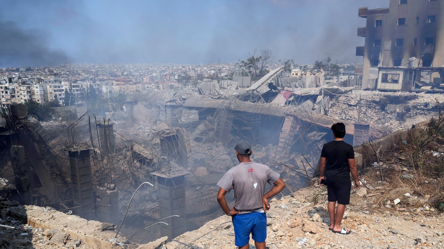 Onlookers were at the site of a destroyed building after an Israeli airstrike in Choueifat, south east of Beirut, on Saturday.