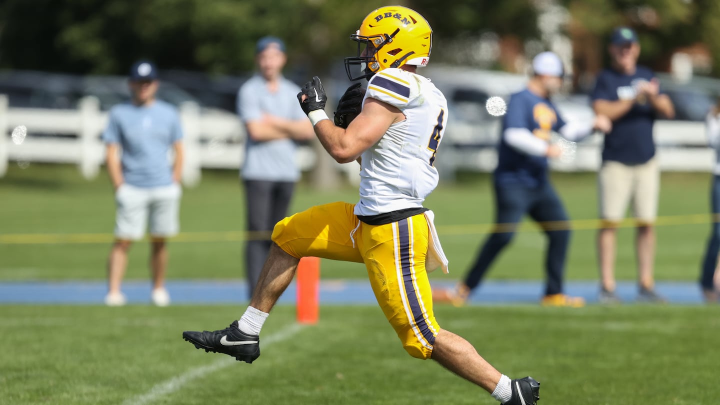 BB&N senior Bo MacCormack prances into the end zone for one of his four touchdowns against host Milton Academy.