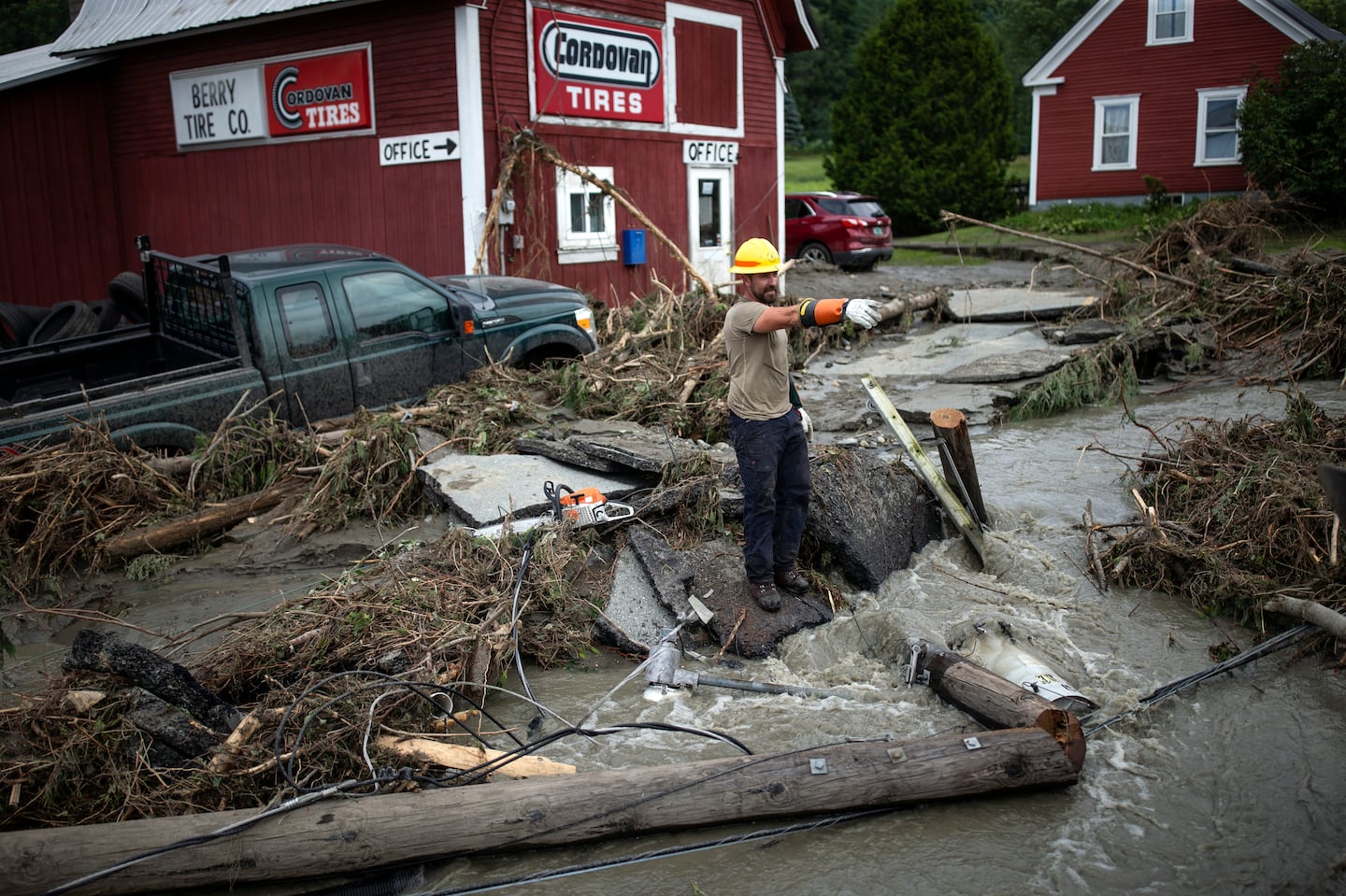 Zac Drown, of Lyndon Electric Co., stood amid flood damage in Lyndon, Vt., on July 30.