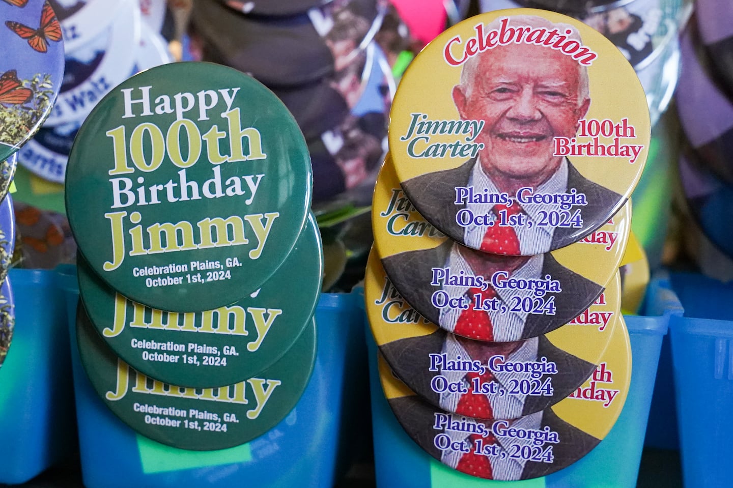 Badges celebrating former president Jimmy Carter were available at the Plains Peanut Festival on Saturday in Plains, Ga.