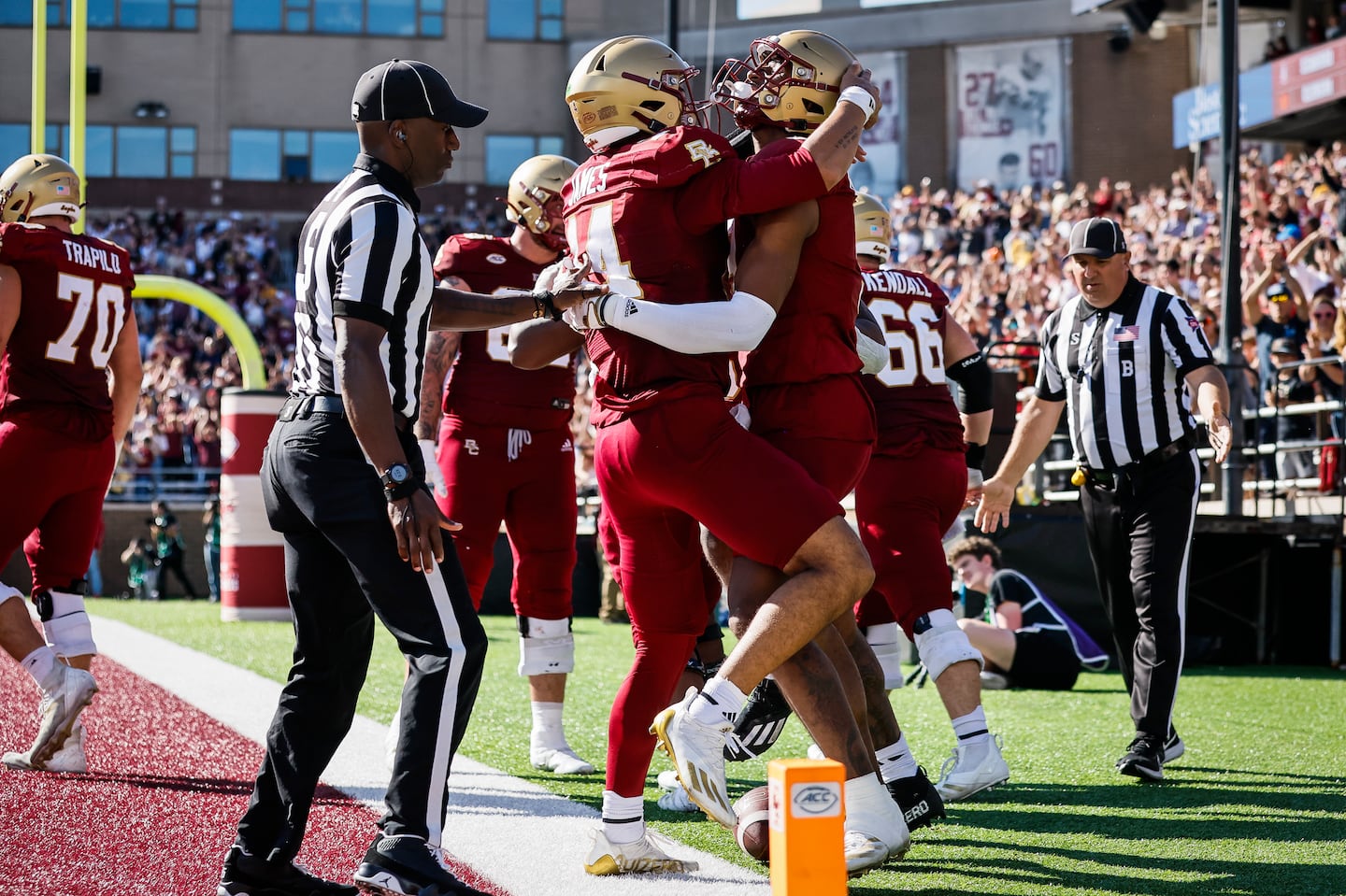 BC quarterback Grayson James embraces Jerand Bradley (right) after Bradley’s touchdown late in the fourth quarter.