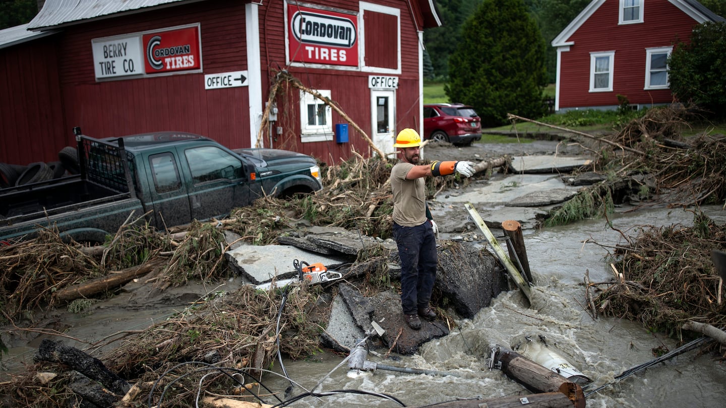 Zac Drown, of Lyndon Electric Co., stood amid flood damage in Lyndon, Vt., on July 30.