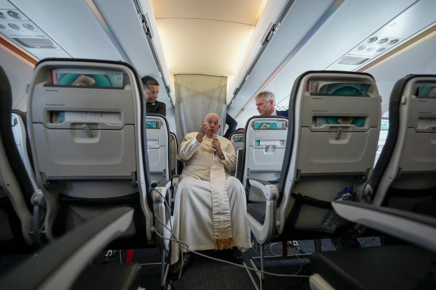 Pope Francis talks to journalists on a flight back to Rome at the end of a four-day visit to Luxembourg and Belgium on September 29, 2024.