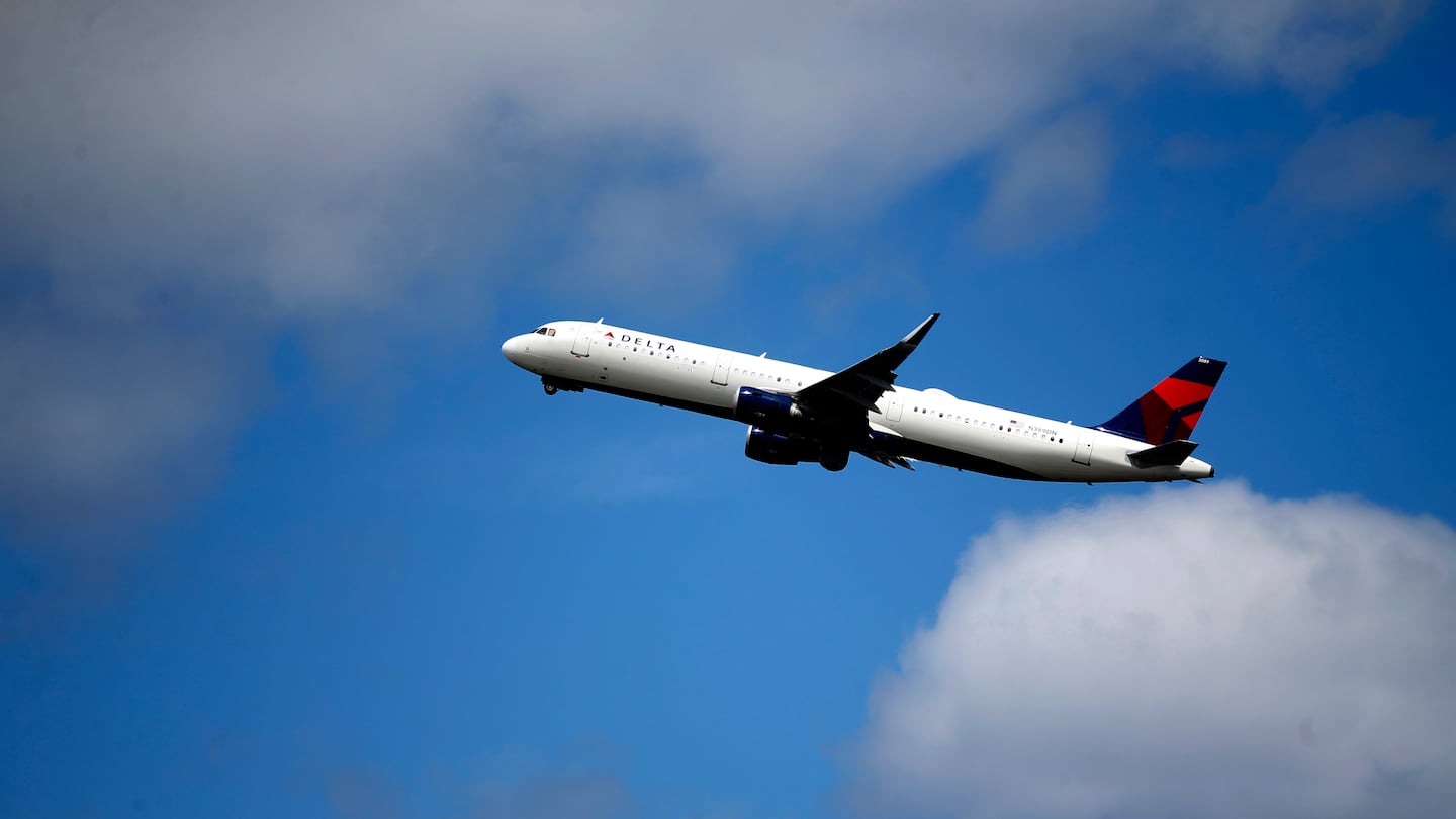 A Delta Air Lines jet takes off from Logan International Airport in June 2022.