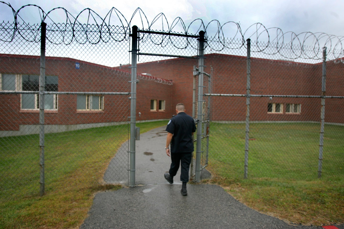 An officer walked the grounds of the Massachusetts Treatment Center in Bridgewater.