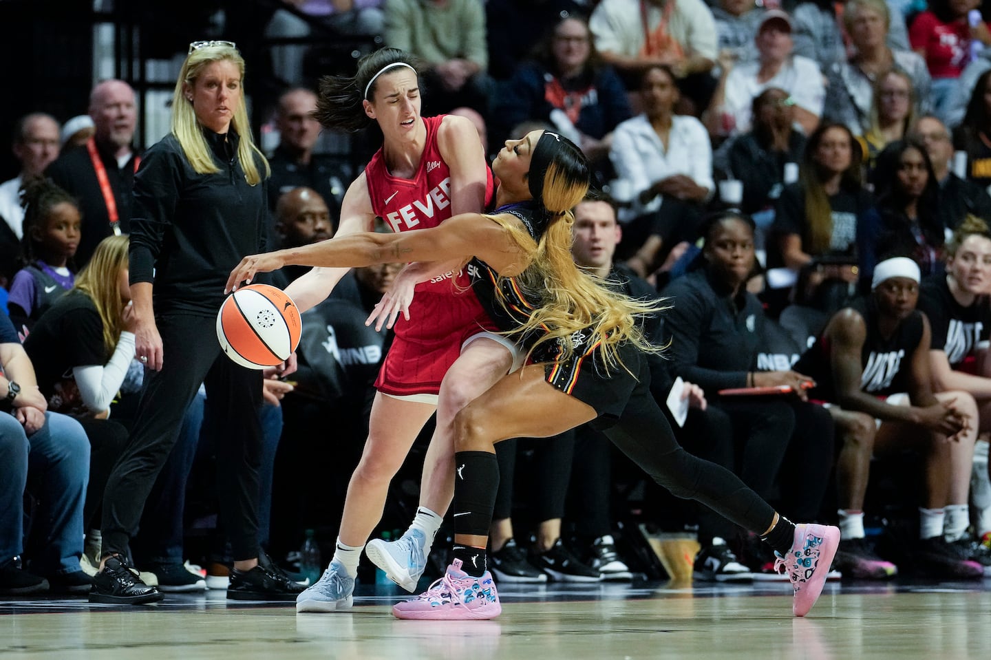 The physical play between Indiana's Caitlin Clark (left) and Connecticut's DiJonai Carrington led to ill-informed criticism of journalist Christine Brennan by the head of the WNBA's players union.