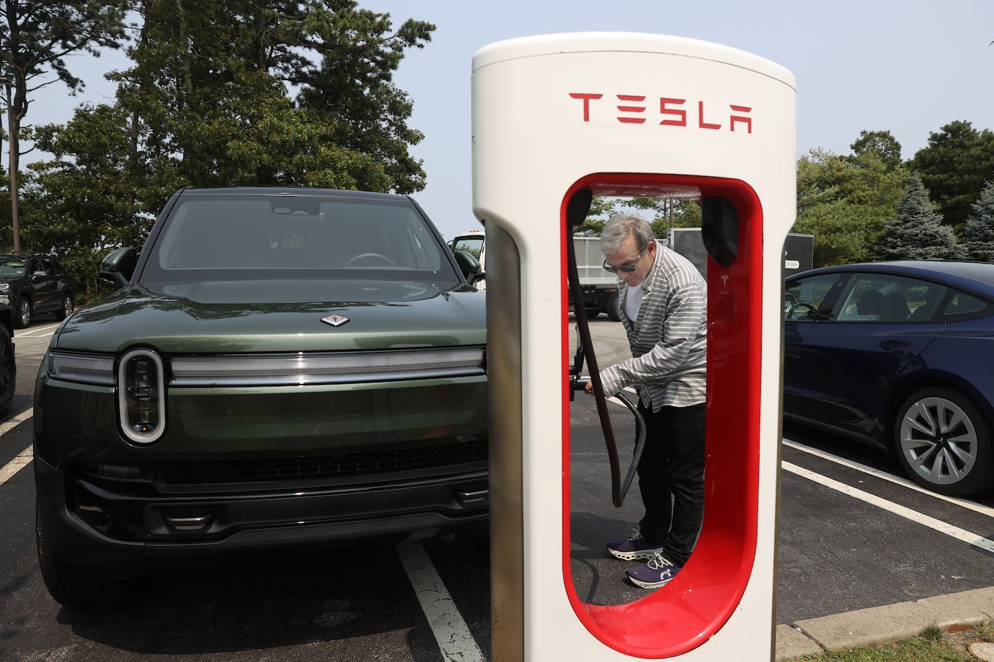 Globe reporter Aaron Pressman charges his Rivian R1S SUV in Hyannis during a one-day ice cream run to test New England’s electric vehicle charging infrastructure.