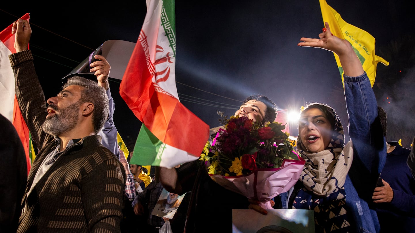 People gather to celebrate Iranian rocket attacks on Israel at Palestine Square in Tehran, Iran, on Oct. 1.