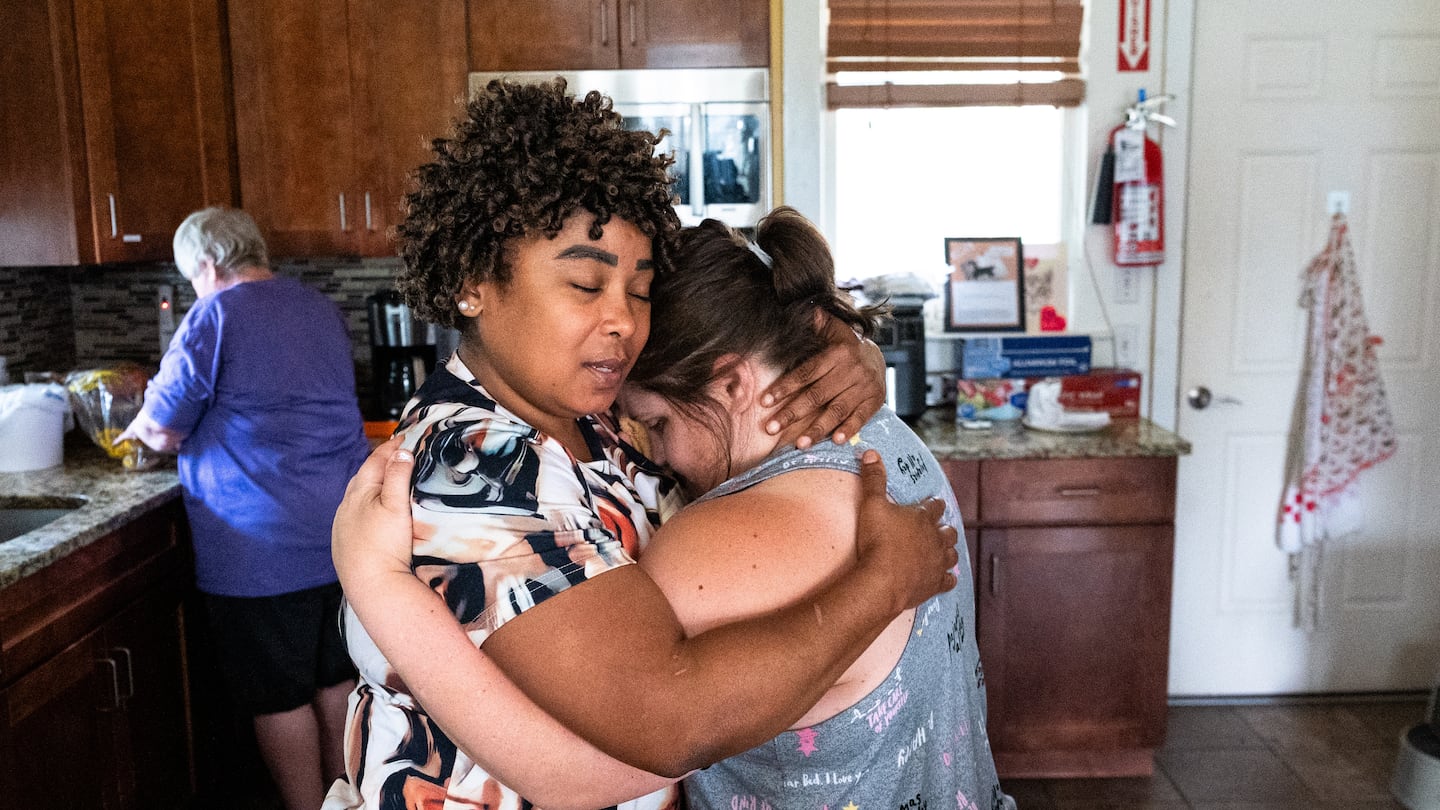 Sindy Micourt hugged resident Kristen Camacho at the Thrive Support and Advocacy center in Marlborough. Camacho was stressed about her irritated eye.