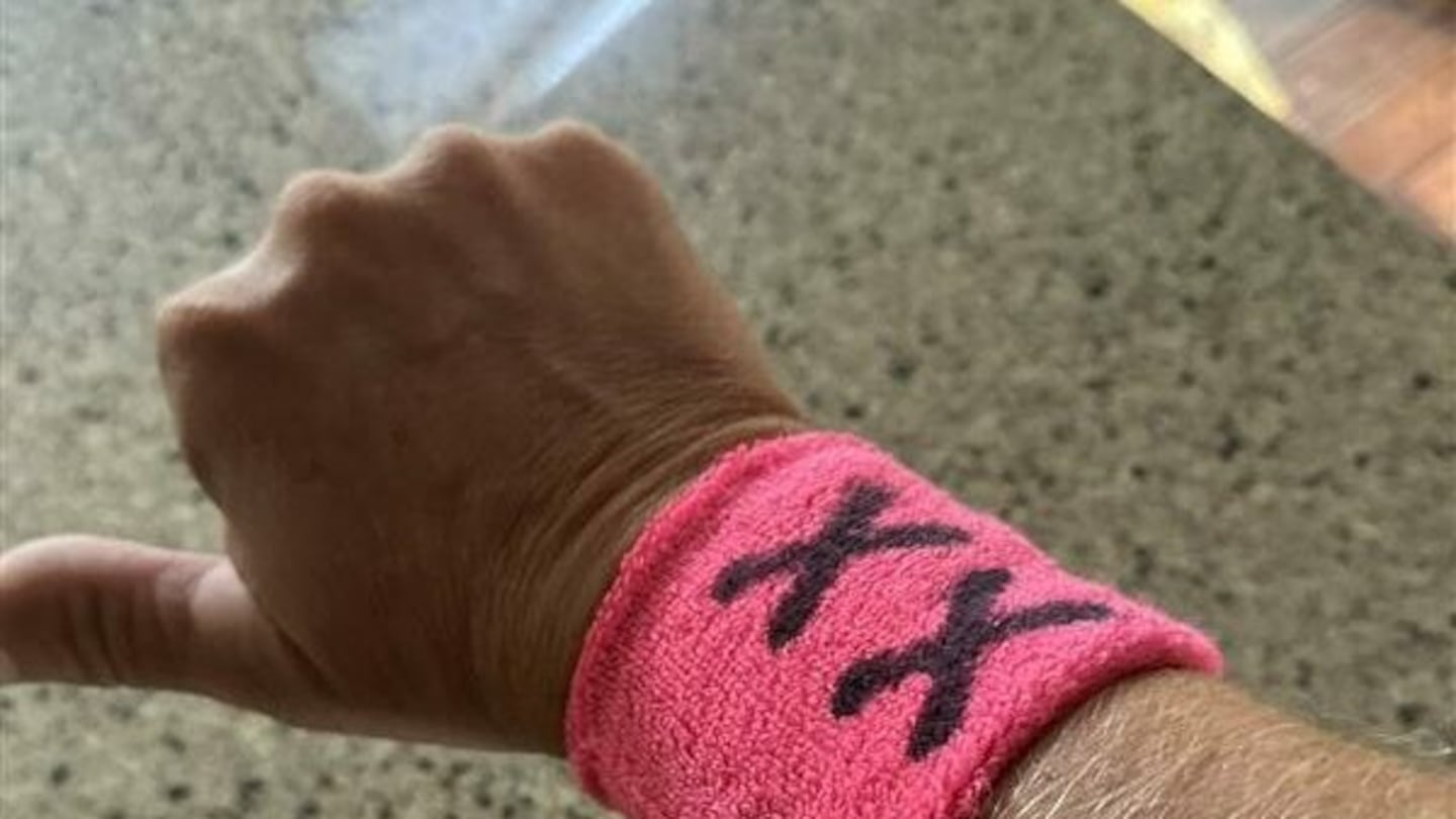 Parents wore pink "XX" wristbands at a soccer match in Bow, N.H., on Sept. 17, 2024, to protest the inclusion of transgender athletes in girls' school sports. School officials shut down the protest and issued "No Trespass" orders, prompting a federal lawsuit.