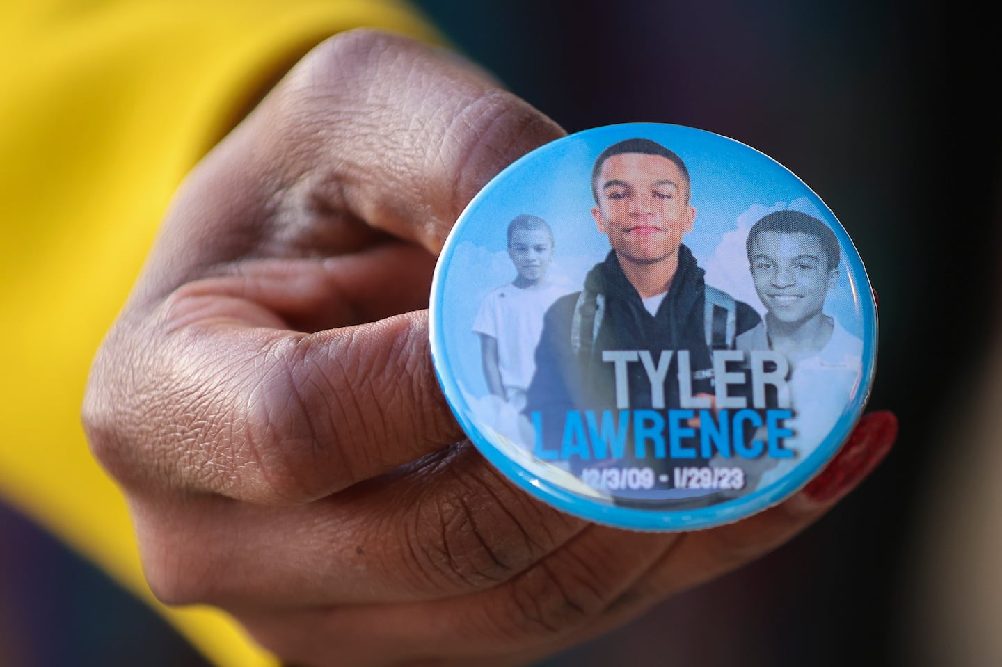 A button of Tyler Lawrence at his memorial in Norwood last year.