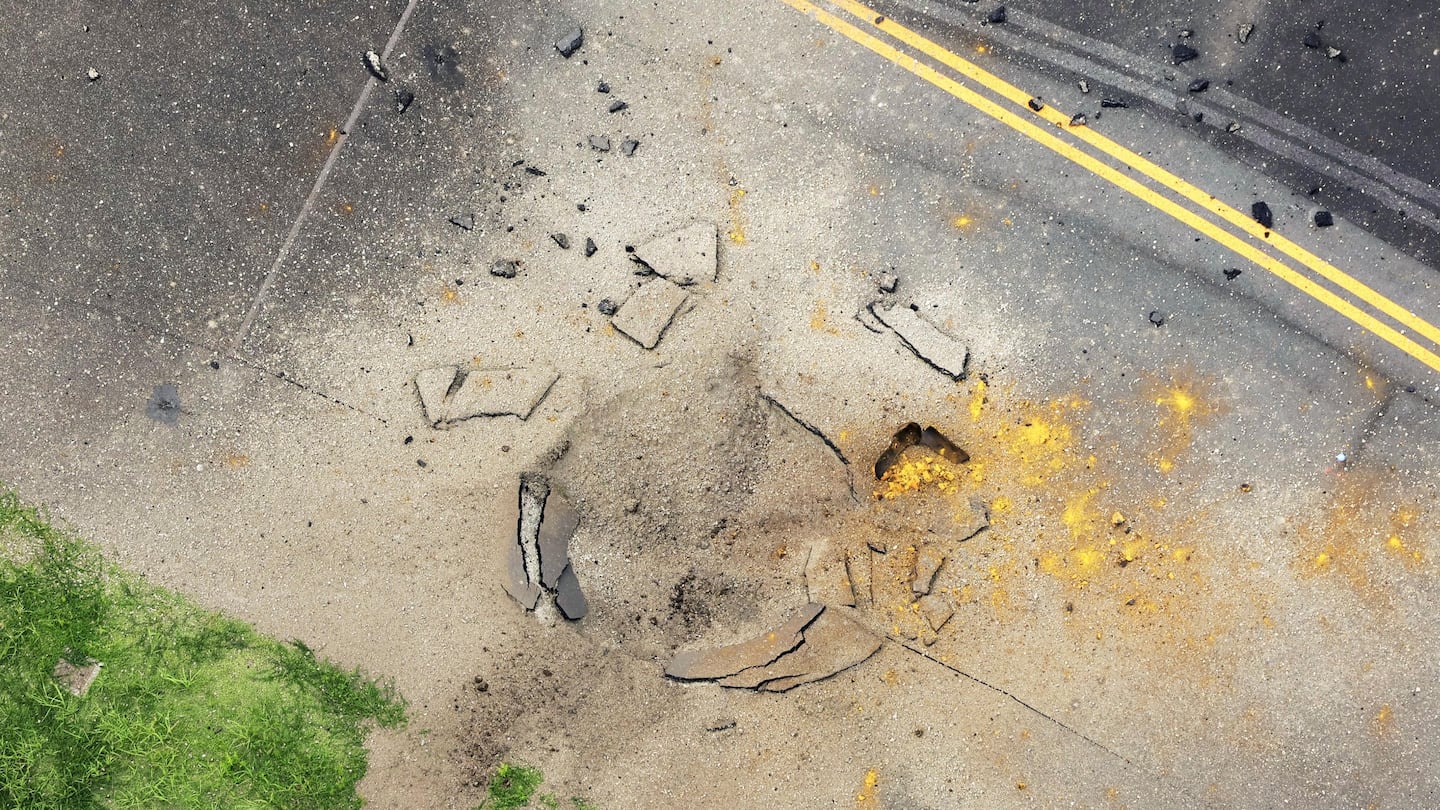 Part of a damaged taxiway at Miyazaki Airport in southwestern Japan, Oct. 2, after an explosion was reported.