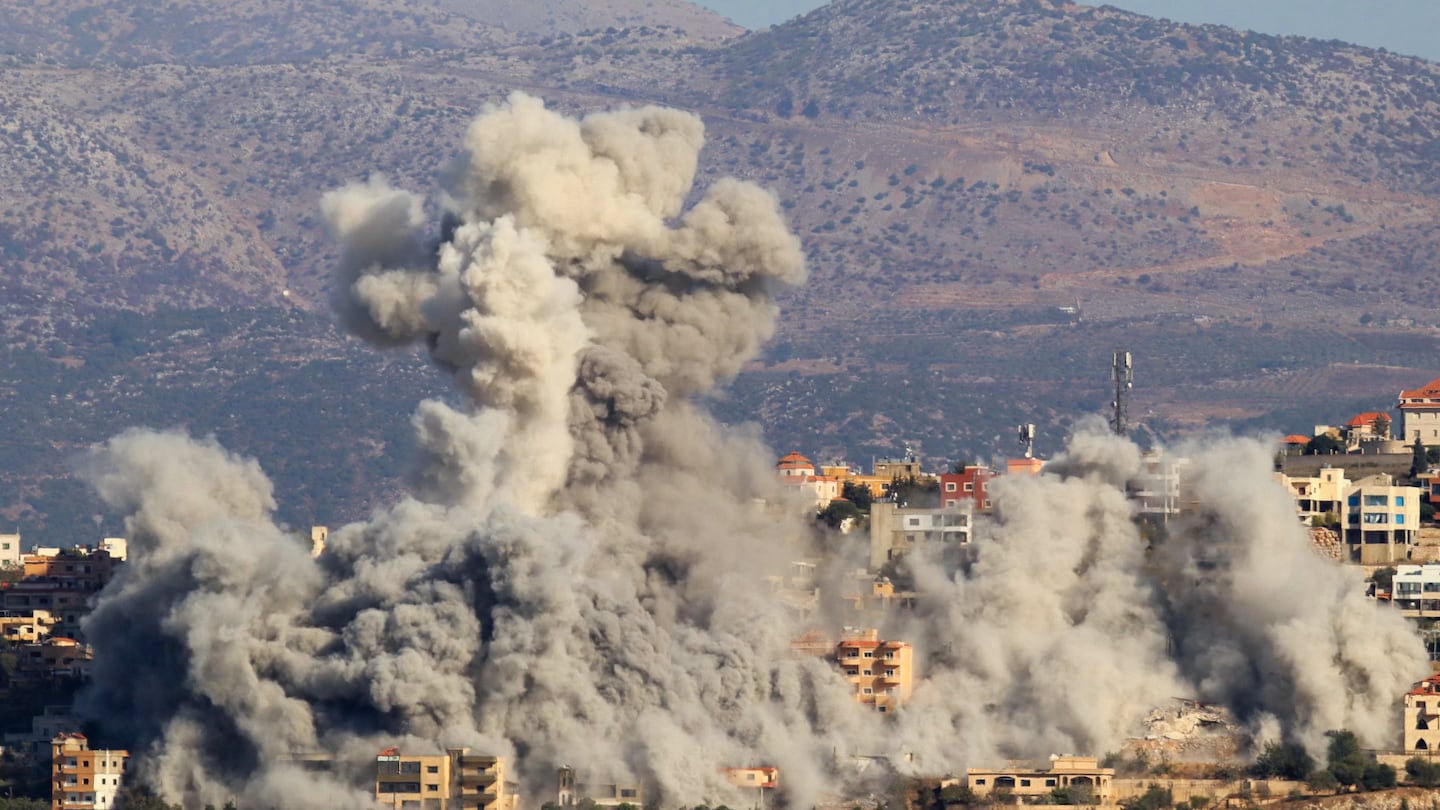 Smoke billowed during an Israeli airstrike on the the southern Lebanese village of Khiam near the border with Israel on Thursday.