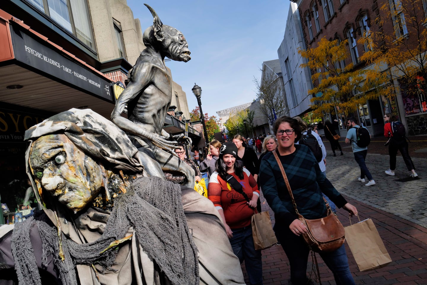 People passed by Halloween decorations in Salem on Oct. 12, 2022.