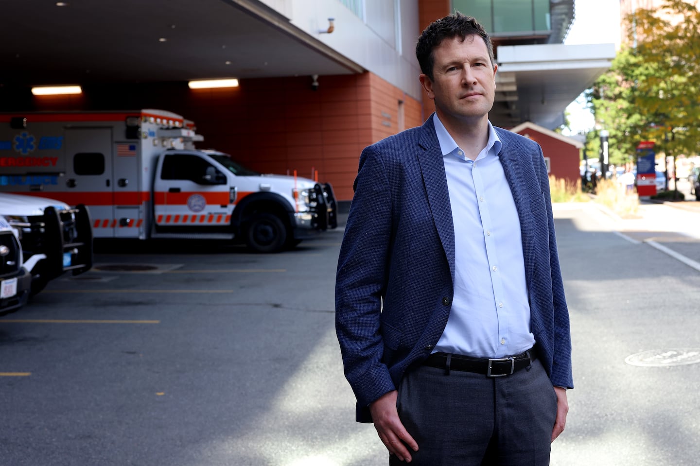 Boston Medical Center chief executive, Dr. Alastair Bell, posed for a portrait outside of Boston Medical Center.