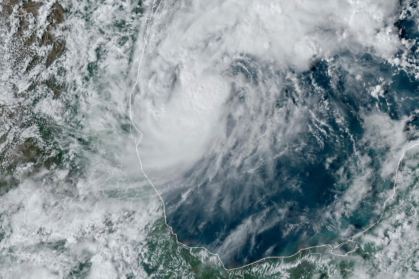 This GOES-16 GeoColor satellite image taken at 4:50 p.m. EDT and provided by National Oceanic and Atmospheric Administration (NOAA) shows Tropical Storm Milton, center, off the coast of Mexico in the Gulf of Mexico, Saturday, Oct. 5.