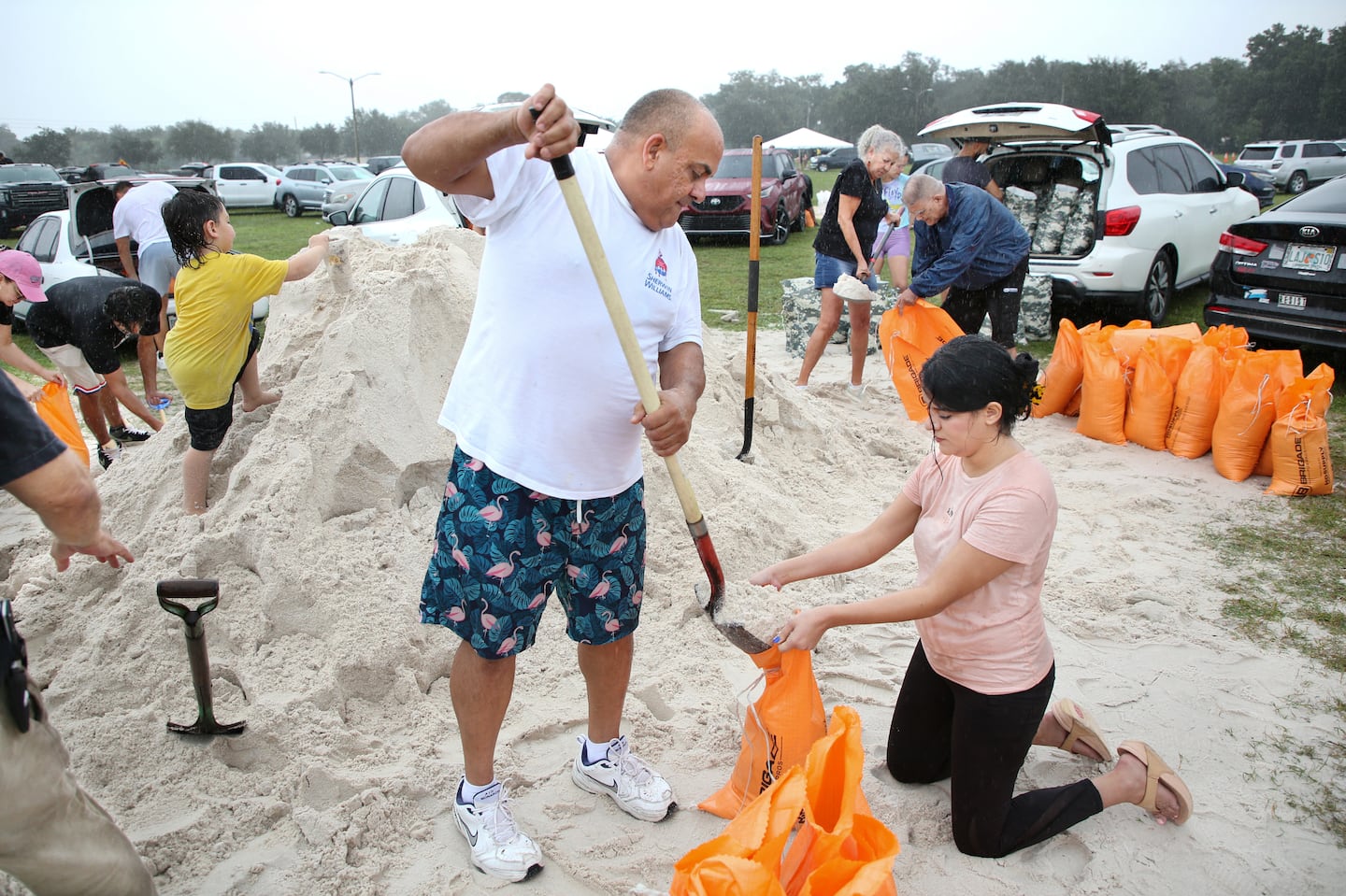 Residents filled sandbags as rain started to fall in Kissimmee, Florida, on Sunday ahead of Tropical Storm Milton.