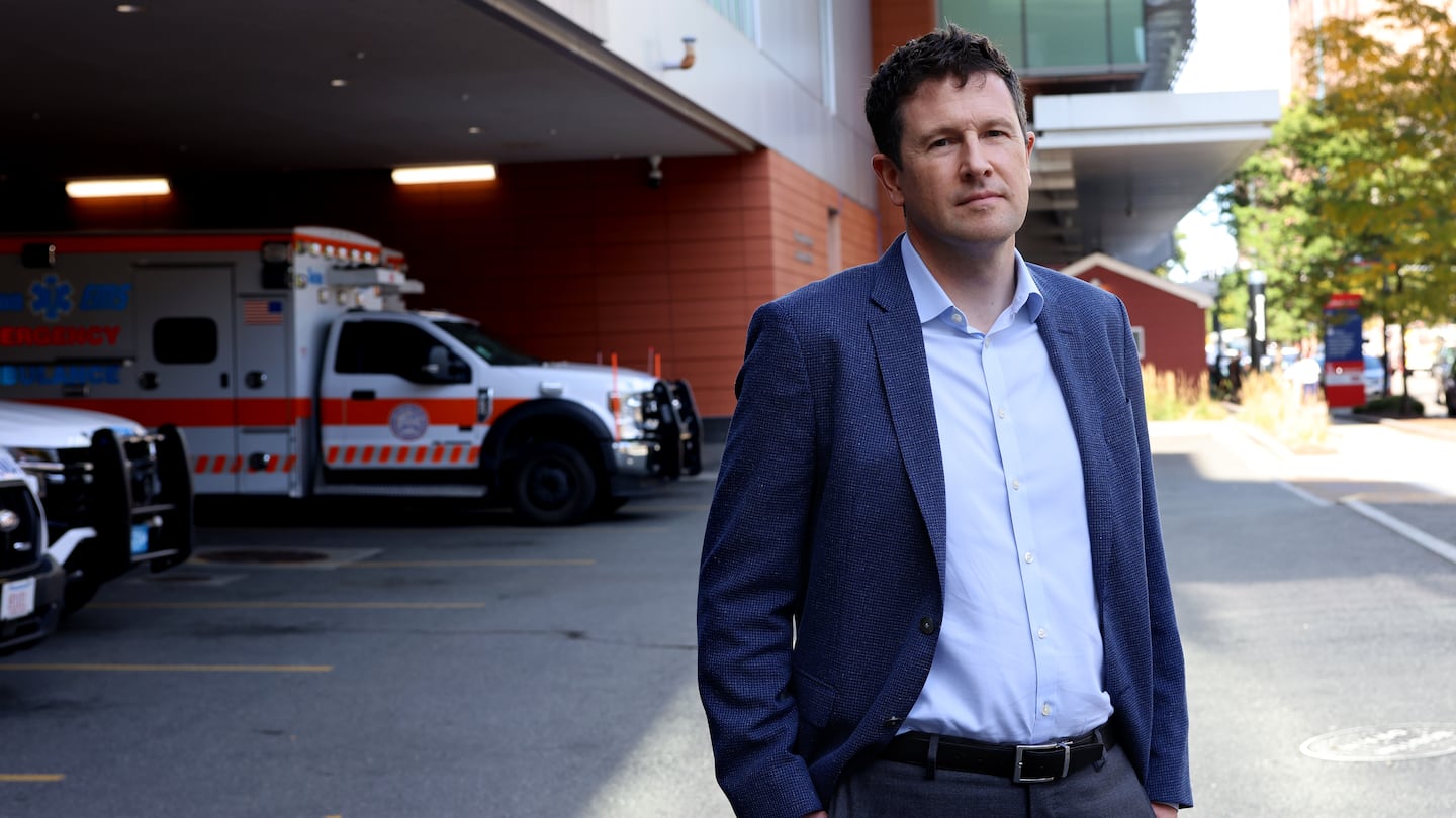 Boston Medical Center chief executive, Dr. Alastair Bell, posed for a portrait outside of Boston Medical Center.