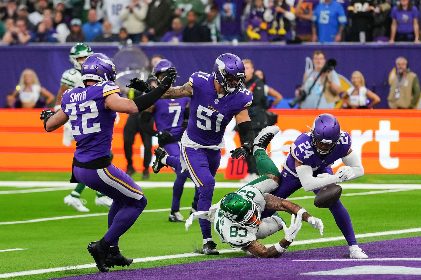 Jets tight end Tyler Conklin was swamped by Vikings defenders as a pass for him was broken up at the goal line.