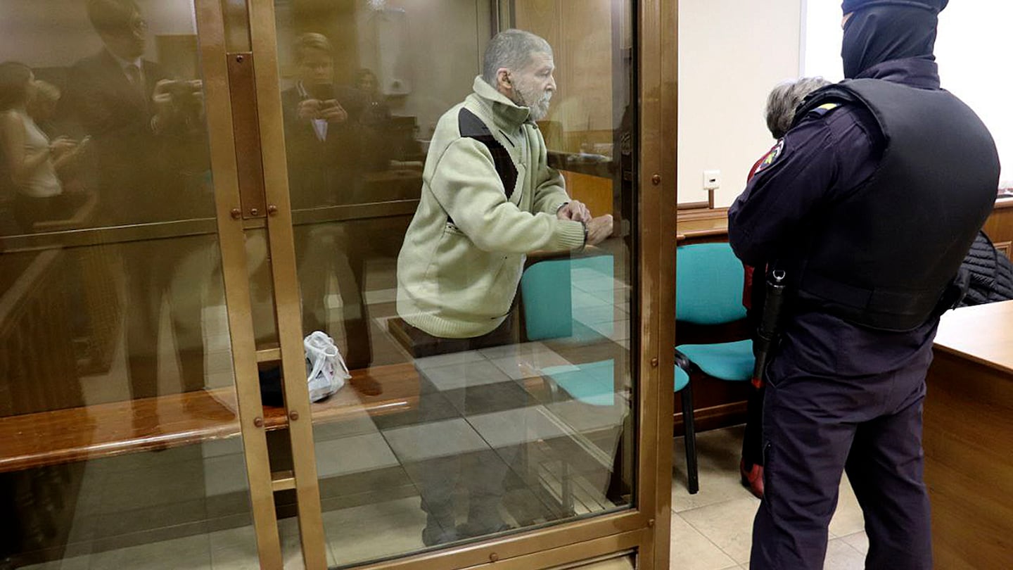 Stephen Hubbard, a US citizen accused of fighting as a mercenary in Ukraine against Russia, stands in a glass cage during a court session in the Moscow City court in Russia, on Oct. 7.