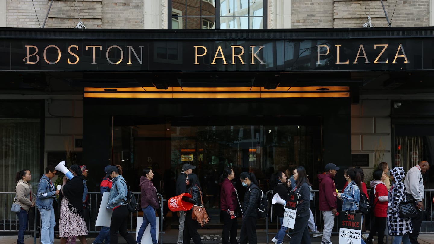 Hotel workers strike outside of the Hilton Boston Park Plaza. They are asking for better wages and more sustainable work hours.