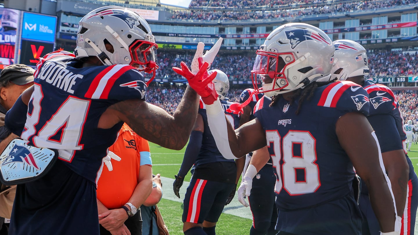 Running back Rhamondre Stevenson (right) had the Patriots' only touchdown against Miami.