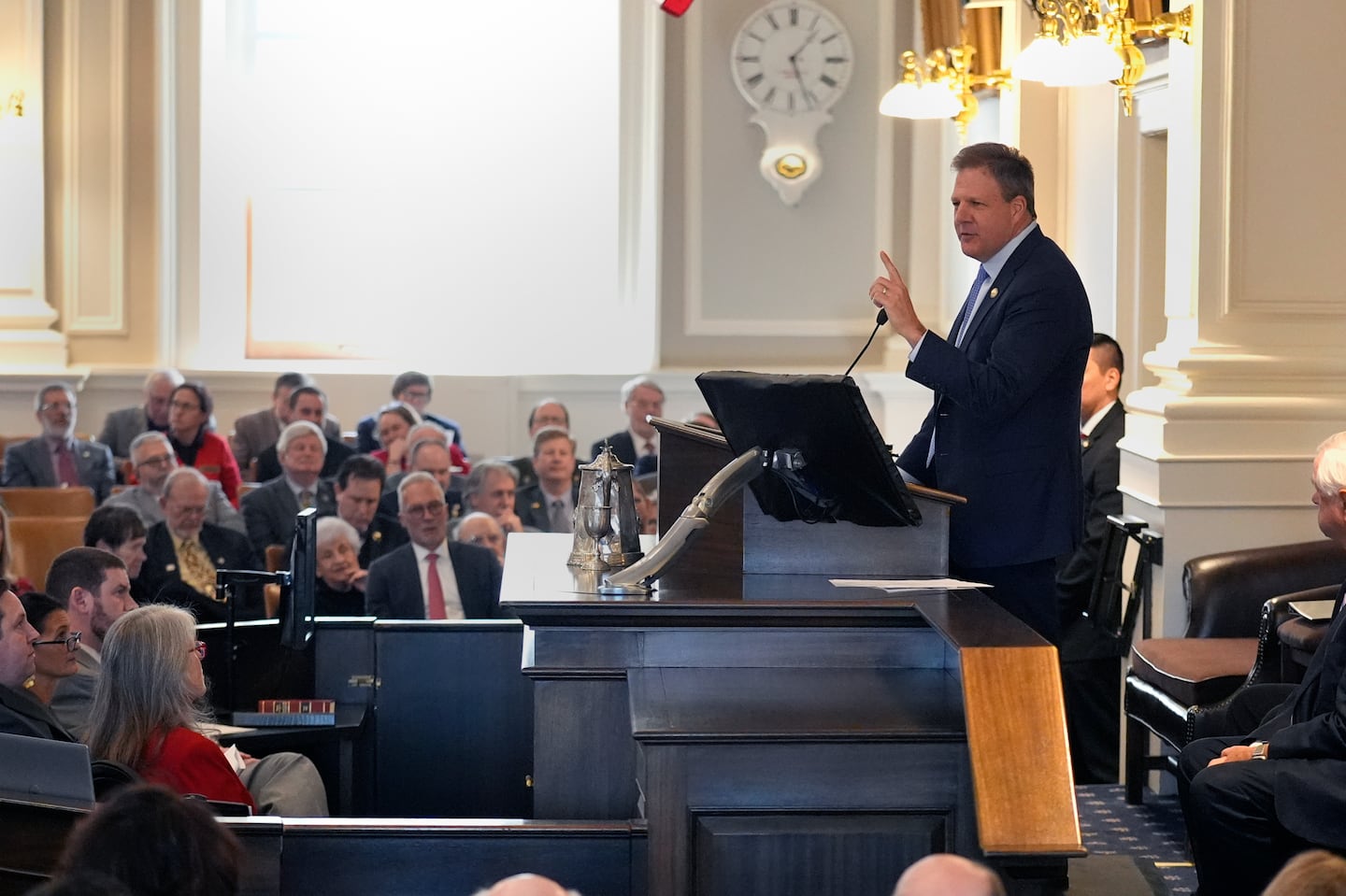 New Hampshire Governor Chris Sununu gestured during his 2024 State of the State address at the State House in Concord, N.H.