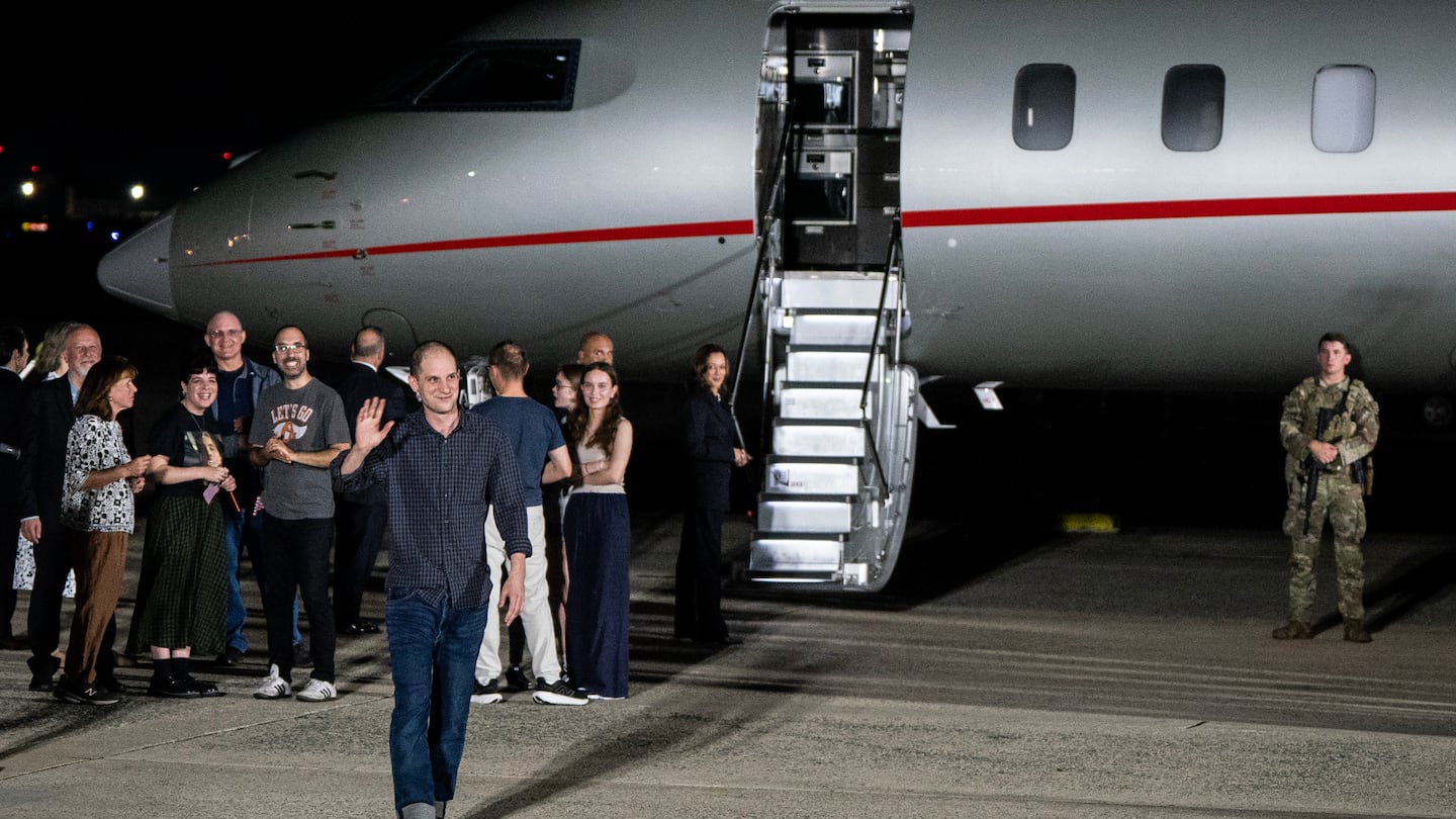 Evan Gershkovich, the Wall Street Journal reporter, waves as he and other prisoners freed from Russia arrived at Joint Base Andrews in Maryland late on Thursday, Aug. 1, 2024.