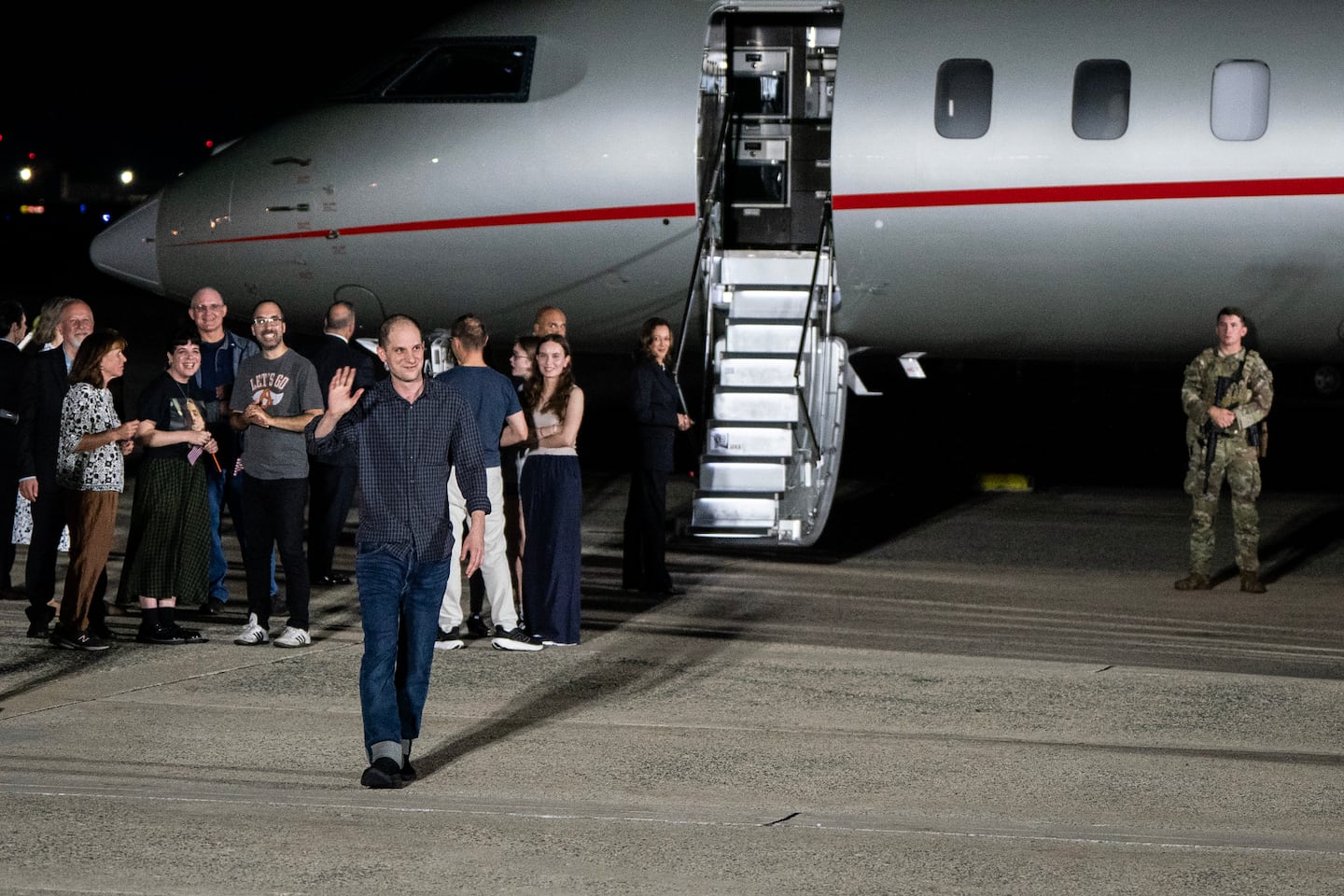 Evan Gershkovich, the Wall Street Journal reporter, waves as he and other prisoners freed from Russia arrived at Joint Base Andrews in Maryland late on Thursday, Aug. 1, 2024.